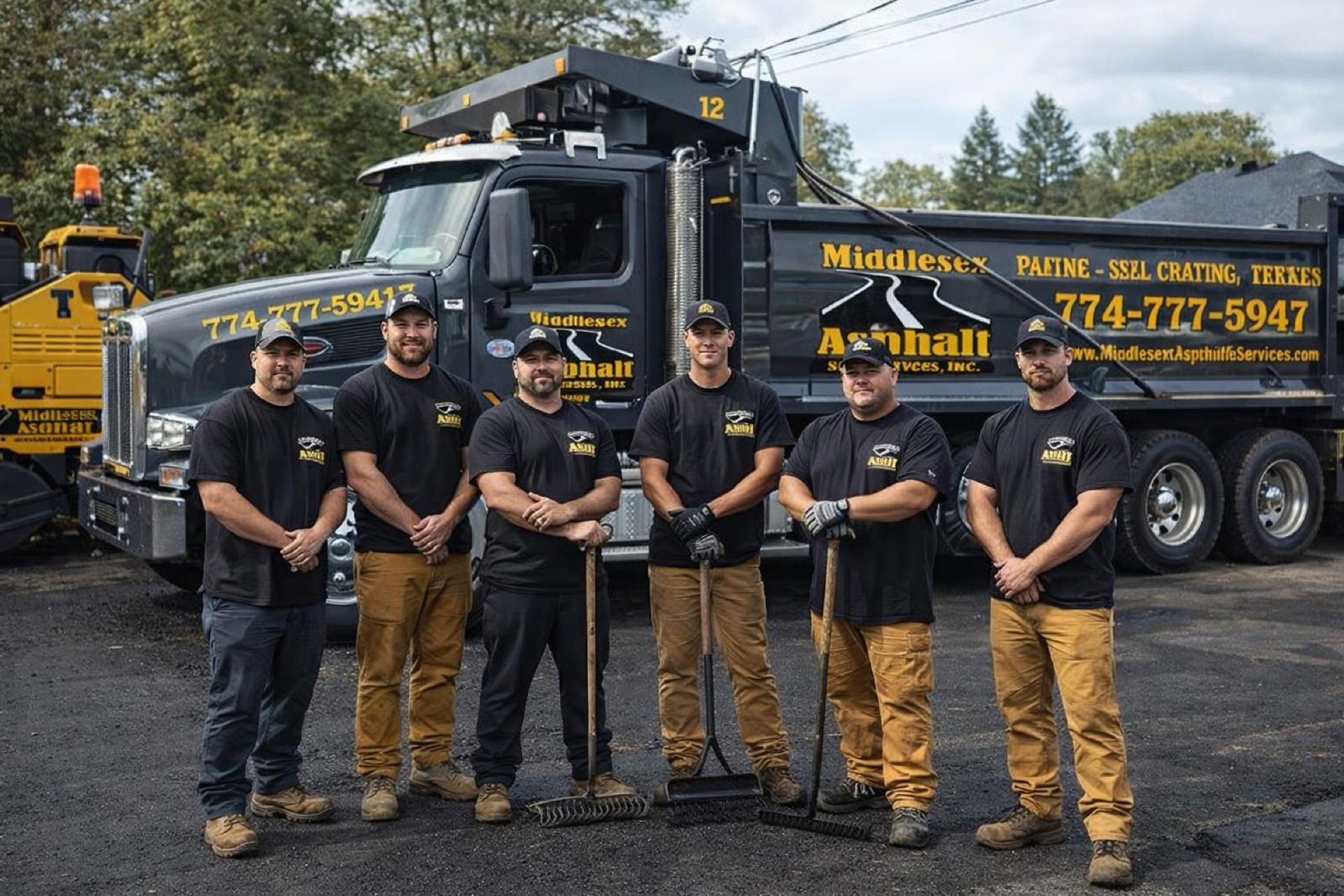 Paving crew standing in front of a company work truck